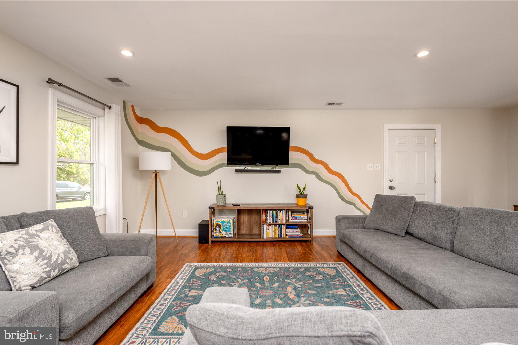 213 Old Magothy Bridge Road Pasadena, MD 21122 - Photo 6 of 31 a living room with furniture and a flat screen tv