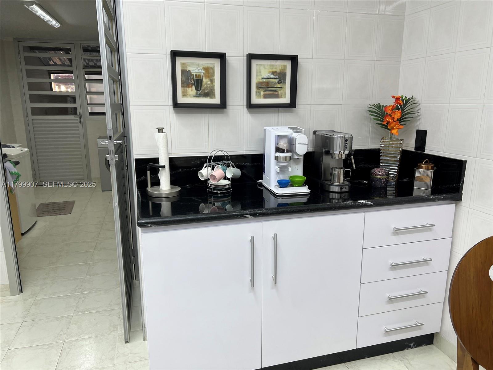 undefined, SP 13930 - Photo 11 of 26 a kitchen with a sink and cabinets