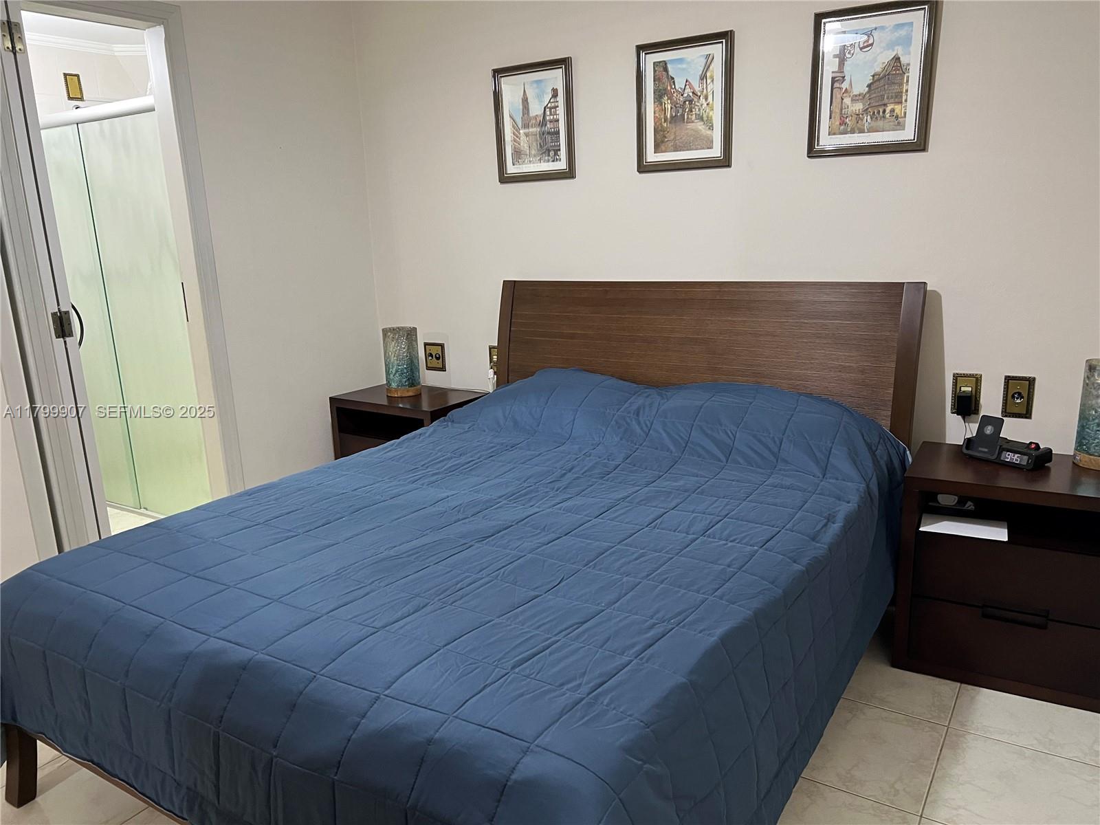 undefined, SP 13930 - Photo 19 of 26 a bedroom with a bed and wooden floor