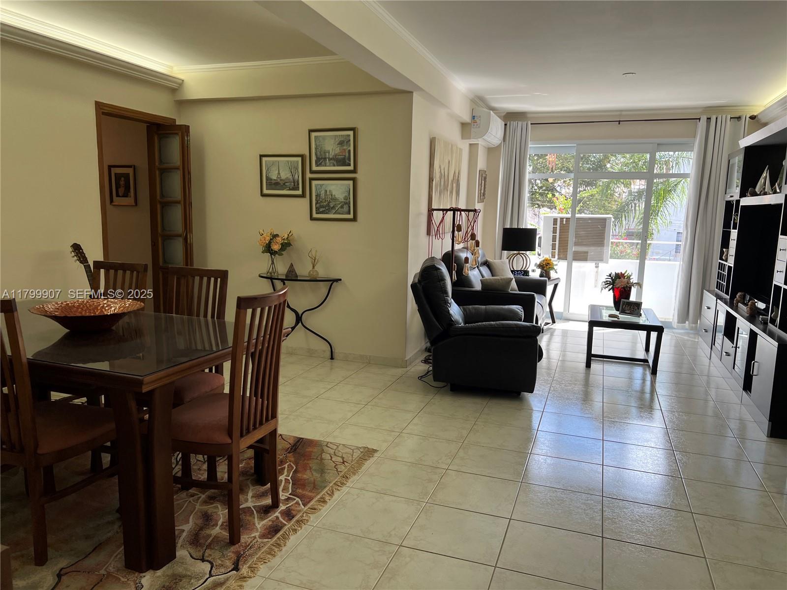undefined, SP 13930 - Photo 2 of 26 a living room with furniture a flat screen tv and a large window