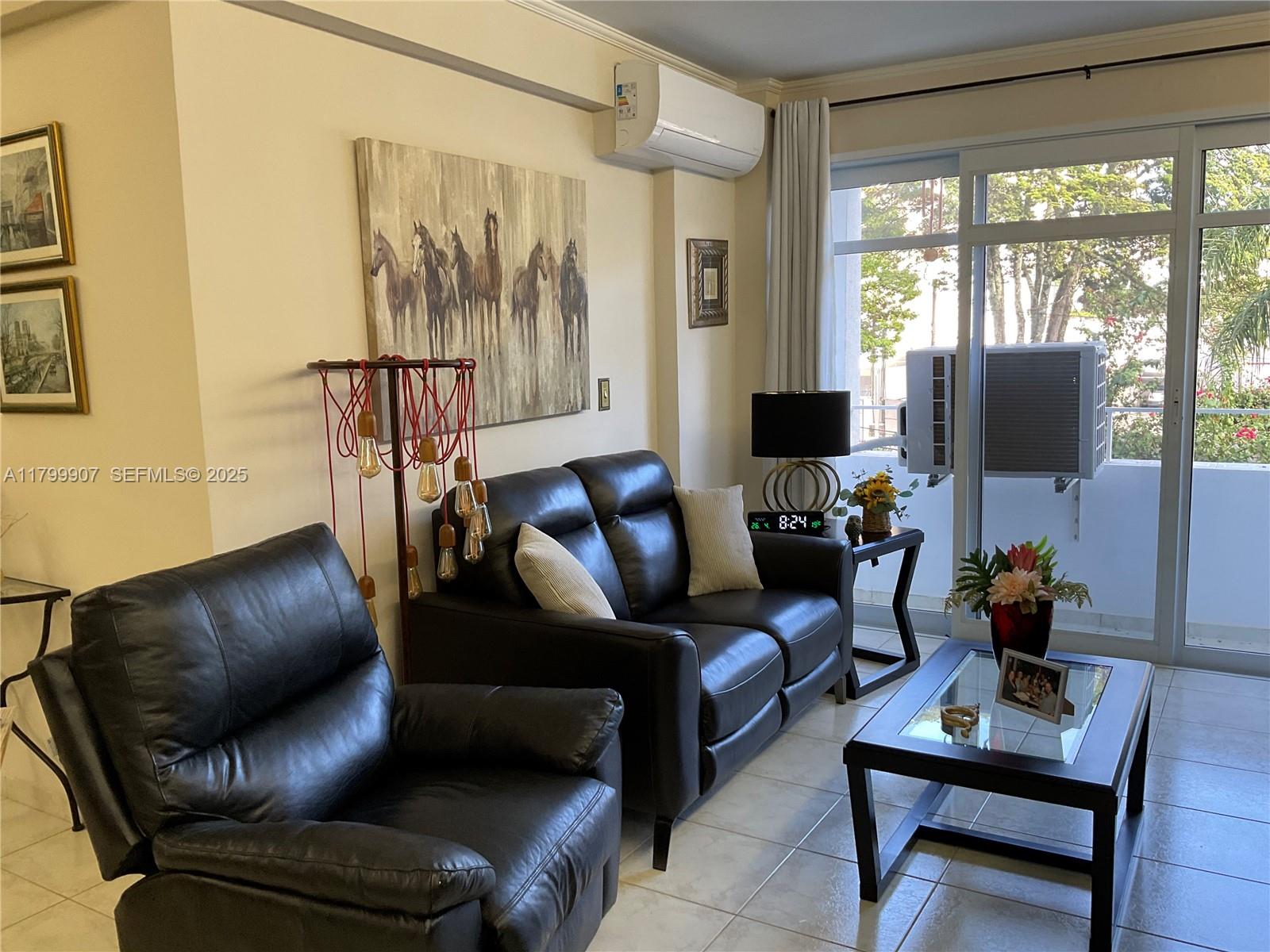 undefined, SP 13930 - Photo 4 of 26 a living room with furniture and a flat screen tv