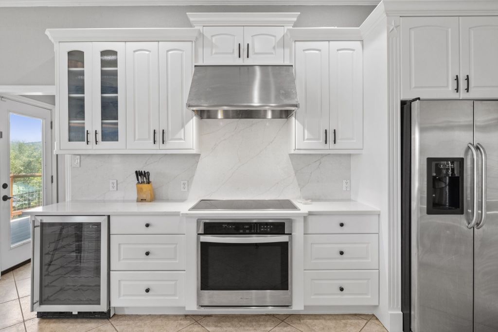 10800 Beach Road Leander, TX 78641 - Photo 5 of 39 Culinary delights await in this bright kitchen with contemporary appliances and ample cabinetry.