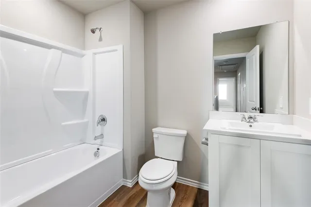 a bathroom with a toilet sink and bathtub