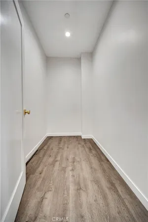a bathroom with a granite countertop double vanity sink a mirror and a toilet