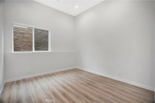 a view of room with wooden floor