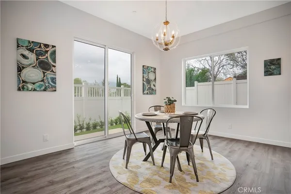 a kitchen with kitchen island a sink appliances and cabinets