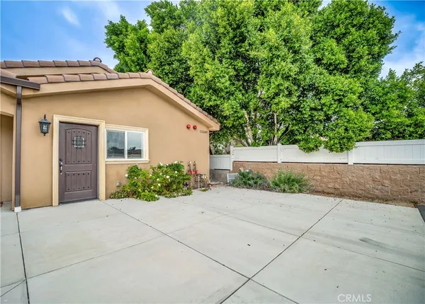 a view of kitchen with wooden floor and electronic appliances