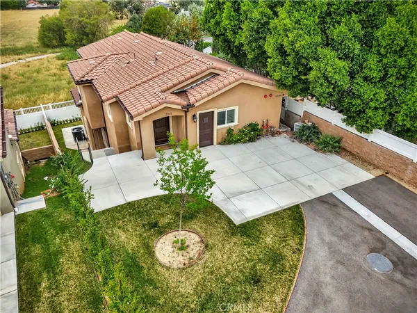 an aerial view of a house with a garden