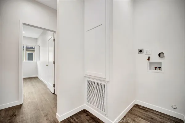 a spacious bedroom with a bed and a large window