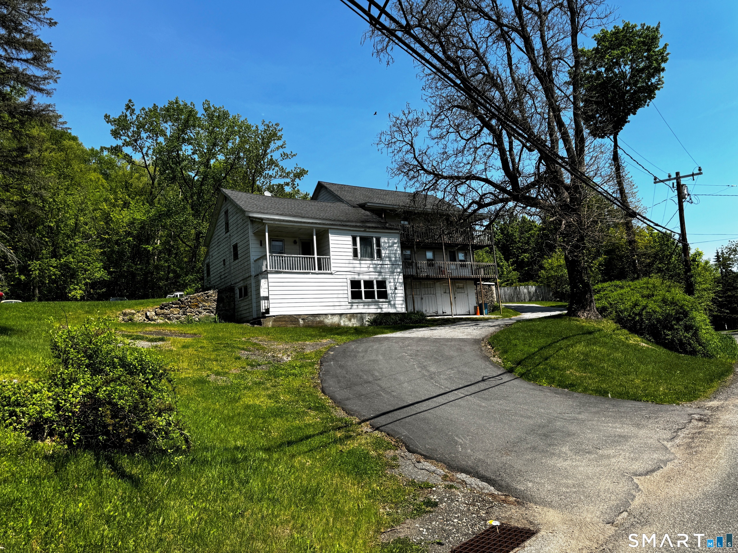 205 Old New Hartford Road Winchester, CT 06098 - Photo 7 of 7 a front view of a house with garden