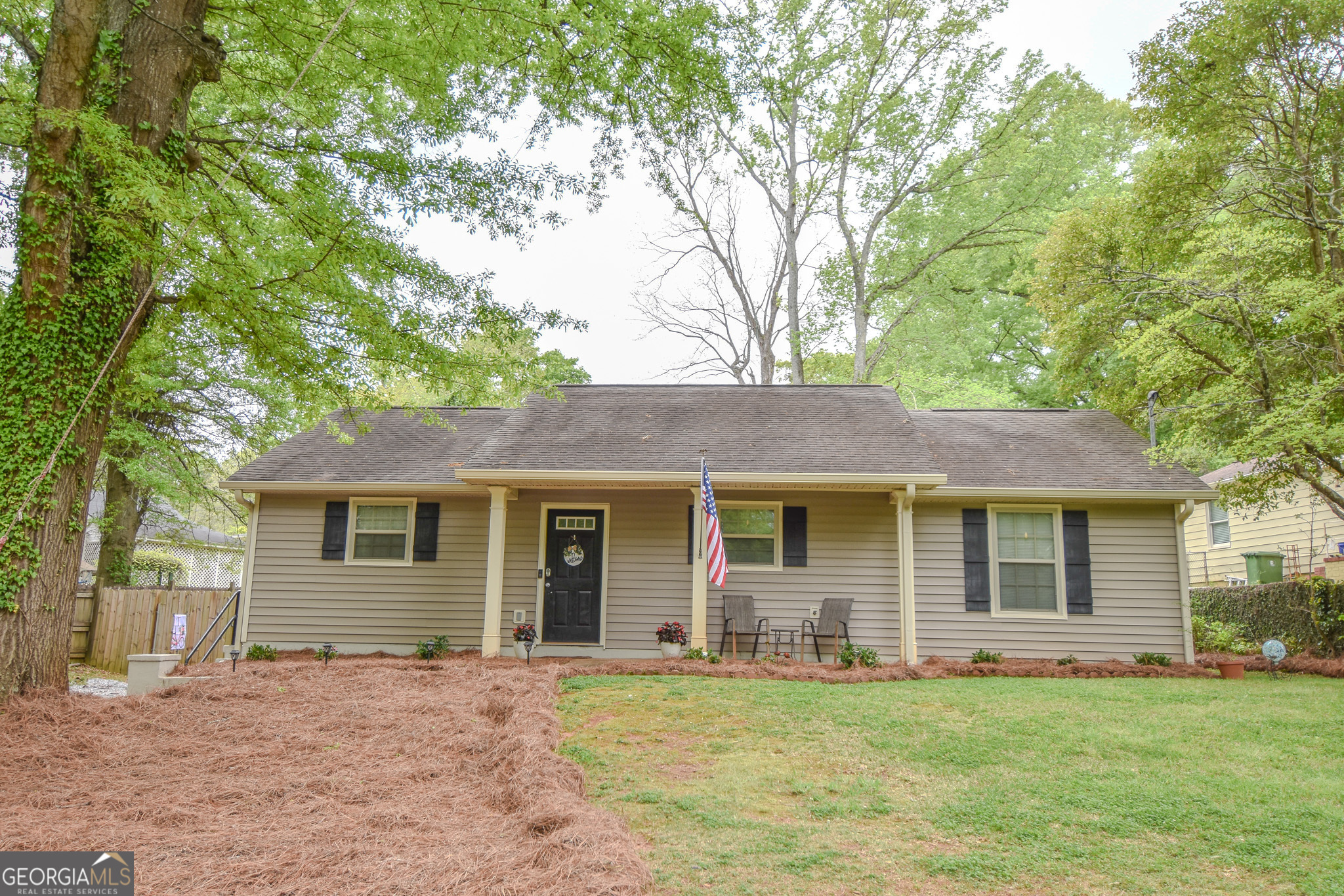 410 Terrace Street Griffin, GA 30224 - Photo 1 of 1 a front view of a house with a garden