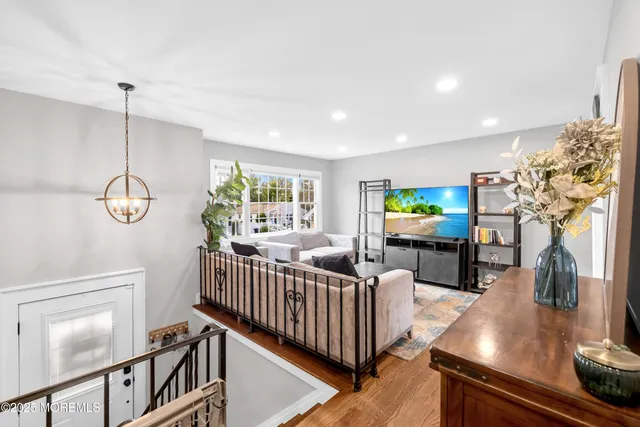 a bed room with a bed and a chandelier