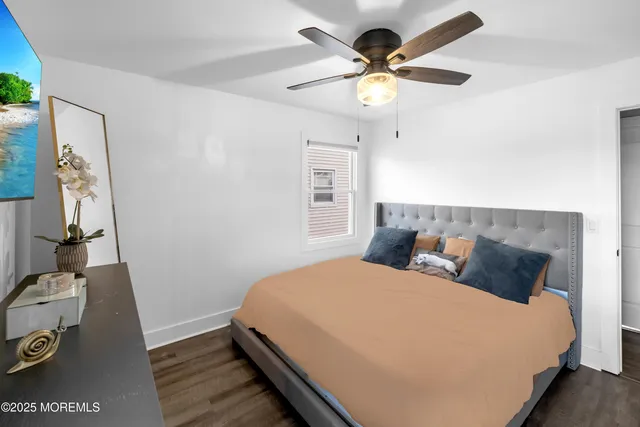 a bedroom with a bed dresser and a window