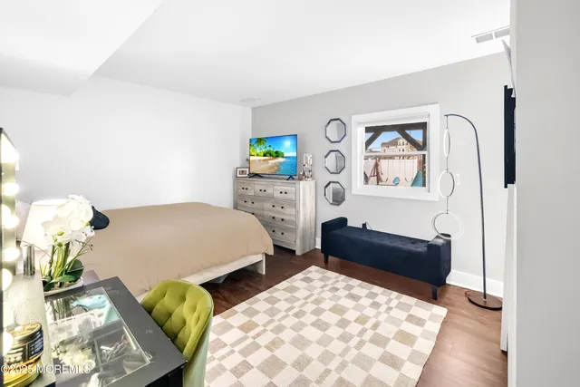 a living room with furniture and a lamp