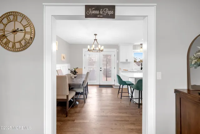 a living room with furniture and a book shelf