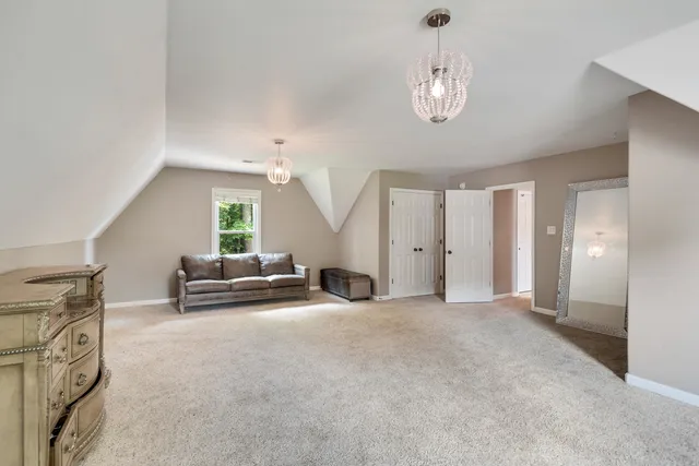 a view of a livingroom with furniture and a chandelier