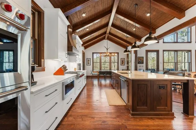 a view of a patio with table and chairs