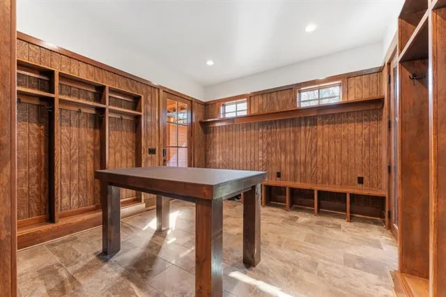 a view of a room with a table and chairs
