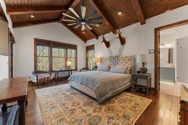 a bedroom with two beds and a window