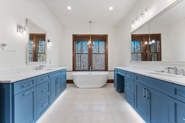 a bathroom with a granite countertop toilet sink and shower