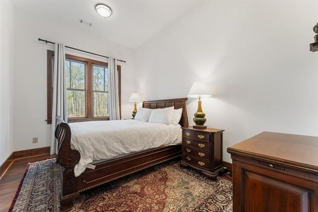 a view of a house with a big yard and potted plants