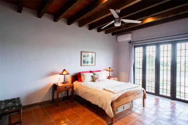 a bedroom with a bed and a chandelier