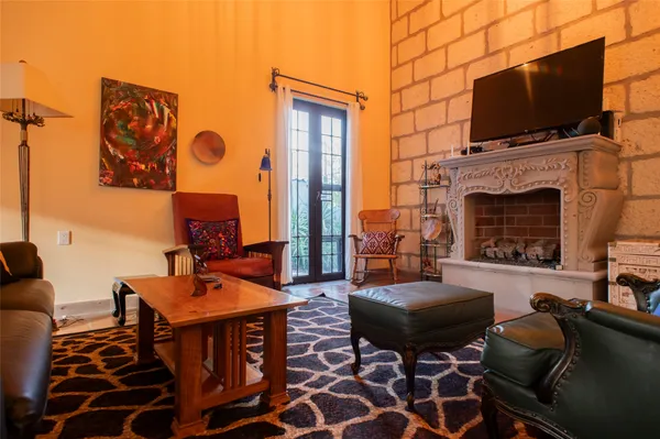a kitchen with stainless steel appliances granite countertop a sink a stove and a wooden floors