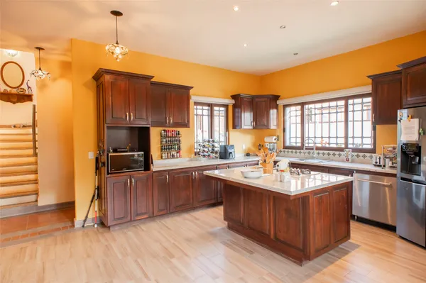 a dining room with furniture and a fireplace