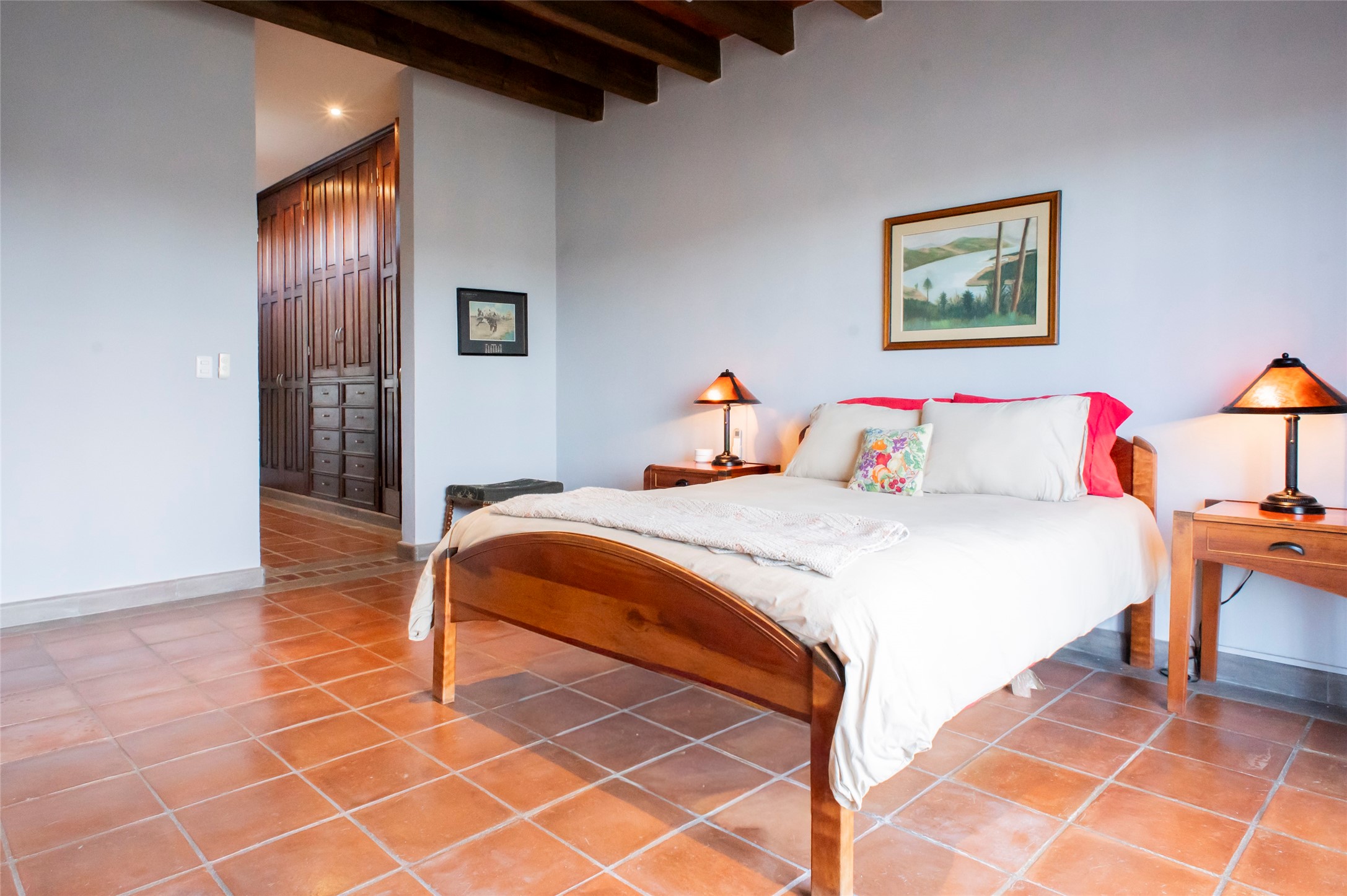 6 Camino Norte undefined, undefined 00000 - Photo 10 of 34 a bedroom with a bed and a lamp on dresser