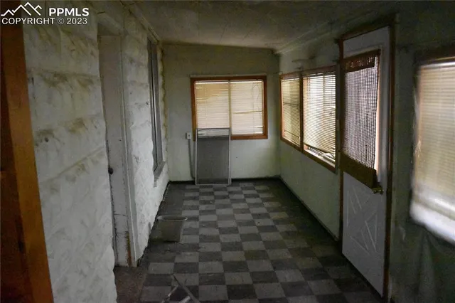 a backyard of a house with lots of green space and plants