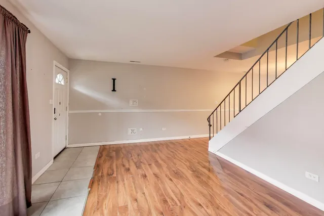 a view of entryway with wooden floor