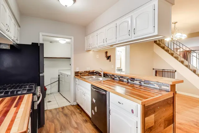 a kitchen with a stove and a refrigerator