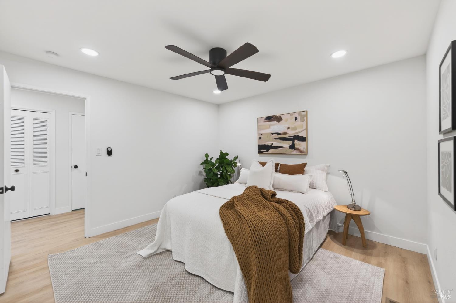2447 Rigdon Street Napa, CA 94558 - Photo 39 of 79 a bedroom with a bed and a painting on the wall