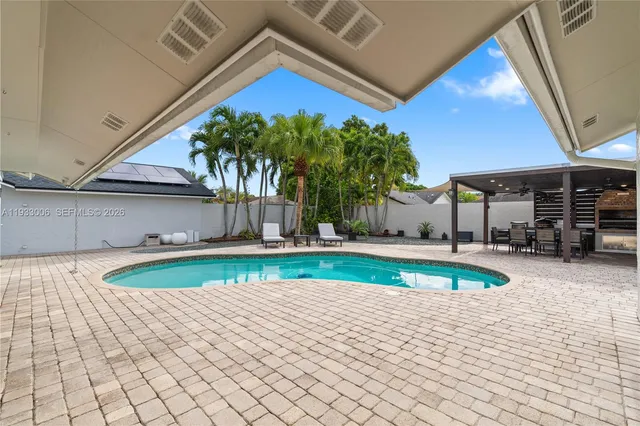 a kitchen with a stove and a refrigerator