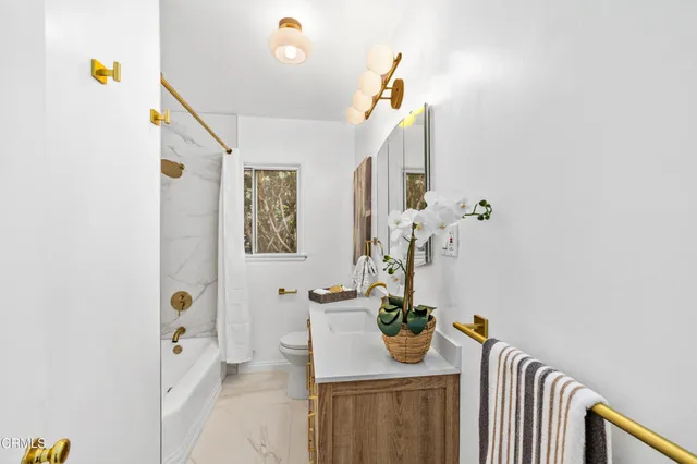 a bathroom with a shower and toilet