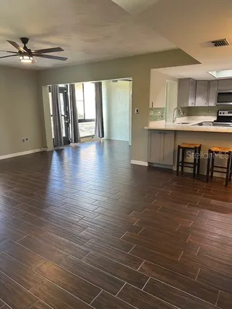 a view of kitchen with cabinets and wooden floor