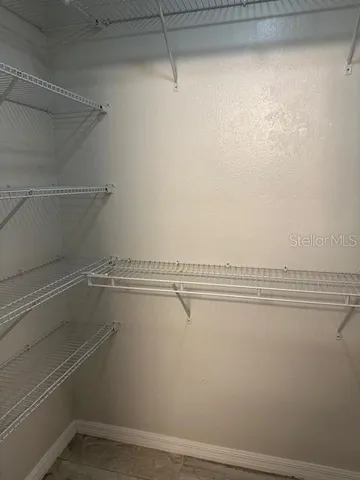 a view of a room with racks on the wall