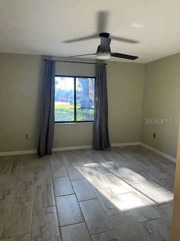 a view of an empty room and window