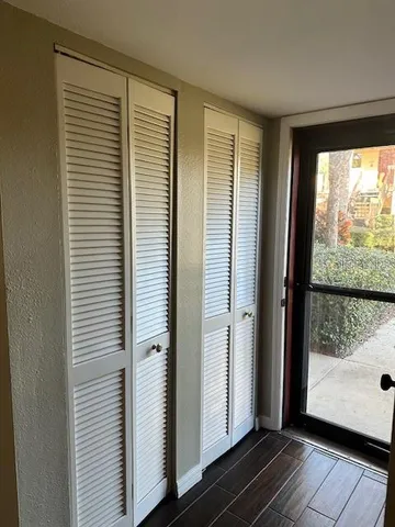 a view of front door with wooden floor