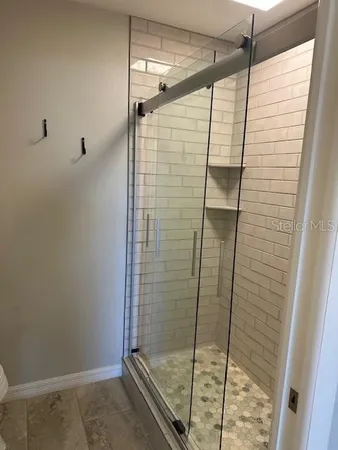 a bathroom with a shower and a toilet
