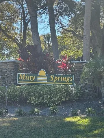 a sign that is on a brick wall