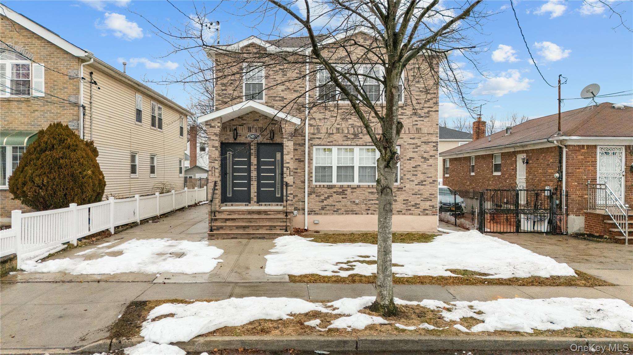 245-33 147th Road, Unit 1 Queens, NY 11422 - Photo 14 of 15 a view of a white house