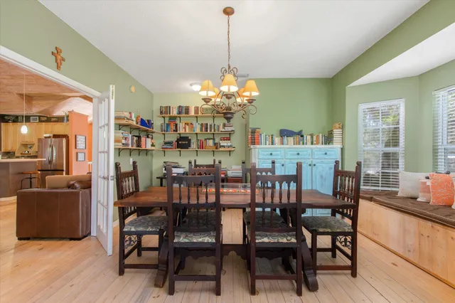 a dining room with furniture and window