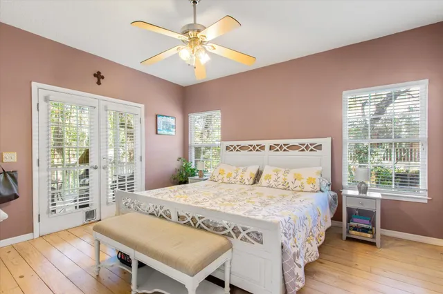 a bedroom with a bed and a table