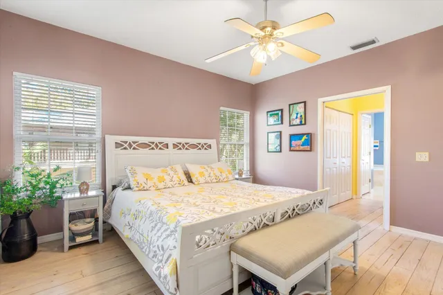 a bedroom with a bed and a table