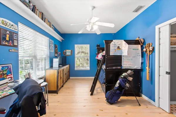 a bedroom with furniture and a window