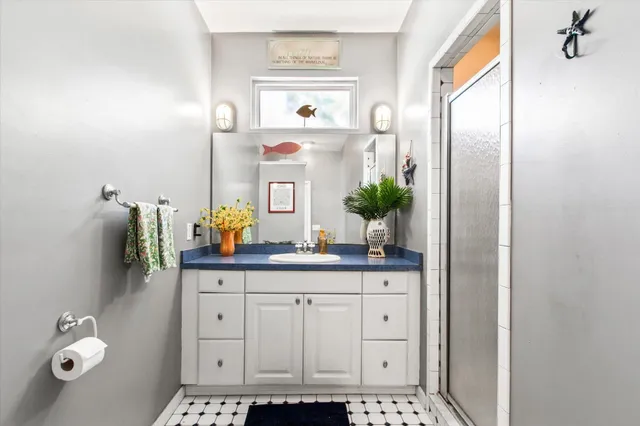 a bathroom with a sink and a mirror