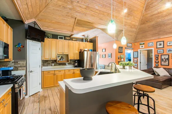 a kitchen with a sink and stove