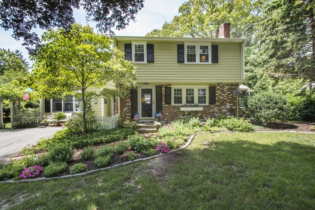 7 Jackson Road Scituate, MA 02066 - Photo 2 of 24 a front view of a house with a yard and porch