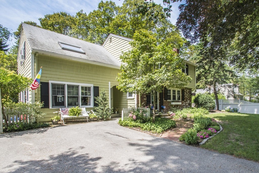 7 Jackson Road Scituate, MA 02066 - Photo 3 of 24 a view of a house with a garden and plants